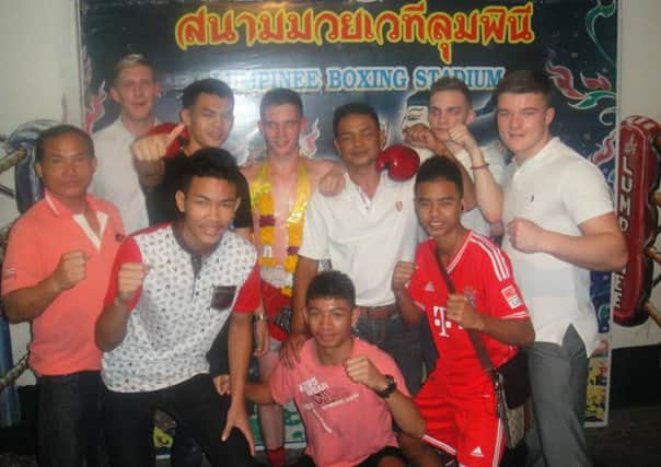 Macauley Coyle, centre, has made his mark among the worlds best in Thailand.