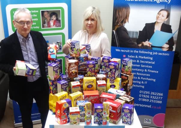 Angela Watson, Plus One Leamington branch manager, with Andy Bower, manager of the Warwick and Leamington Foodbank.