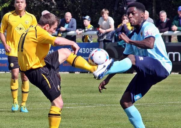 Lee Chilton and Charles Konadu fight it out for a bouncing ball. Picture: Sally Ellis