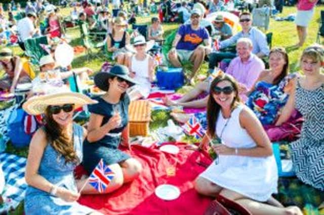 Crowds enjoying summer picnics at a previous Battle Proms at Ragley Hall.