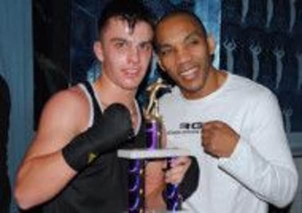 Danny Quartermaine, pictured here with Junior Witter, warmed up for his appearance at Warwick School with a third-round knockout of Charlie Ricketts.