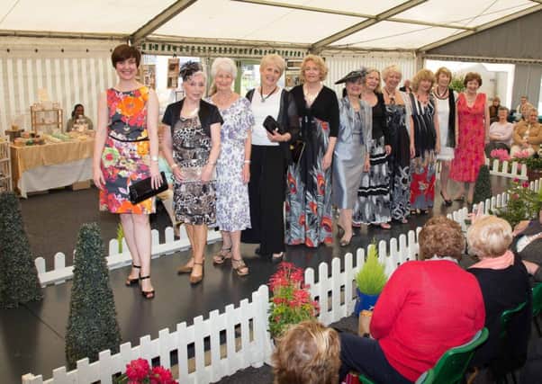 Members of four WI clubs in Warwickshire stepped out on the catewalk at Hatton Shopping Village on April 26 to take part in The Blooming Clothes Show with some cash towards WI Federation.