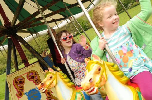 Faith Corry and Ava Craddock enjoy the funfair at Compton Verney's tenth anniversary party.