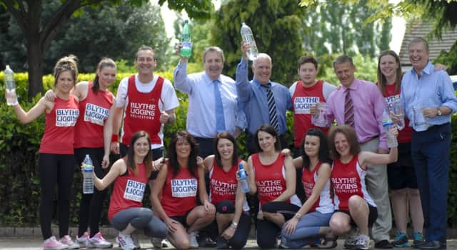 Joint senior partner Richard Thornton (centre back) with the Blythe Liggins Two Castles runners, marshals and water station helpers getting ready for the big day on Sunday, June 8.