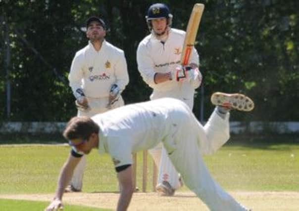 A fierce Scott Stenning drive is smartly fielded by the bowler during Saturdays Birmingham League Premier Division clash. Picture: Morris Troughton