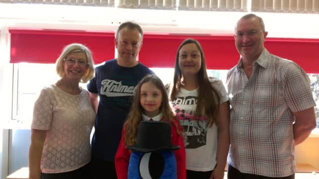 Cubbington schoolgirl Leah Cliffe with her self-designed Ikea toy Bobby Hurbutt, her parents Tanya and Nigel Cliffe and grandparents Andrew and Liz Cliffe.