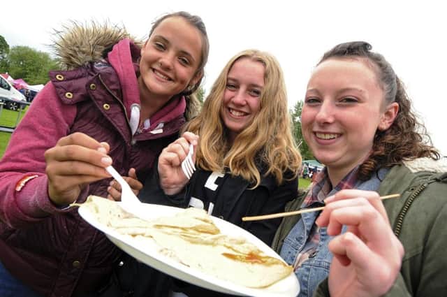 Molly Grant, Eve Turner and Shauna King enjoy some food at Southam carnival.