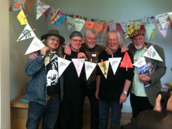 Members of Fairport Convention join in with making bunting at Compton Verney.