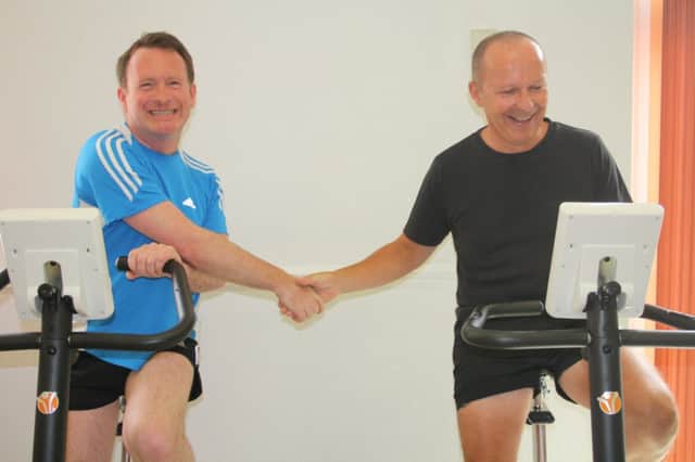 Warwick and Leamington MP Chris White and Warwick Hospital chief executive Glen Burley taking part in Workout at Work Day.