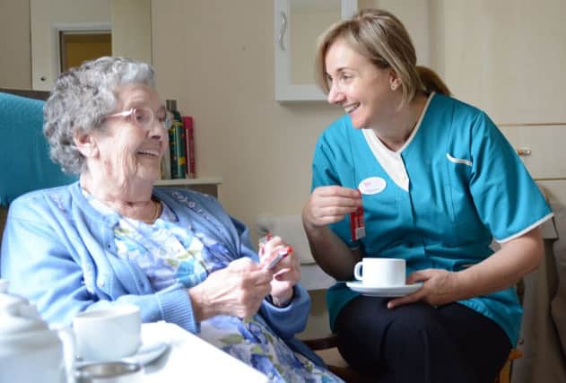 WCS Care chief executive Christine Asbury chats to Mary Edwards, who lives in a WCS care home in Rugby.