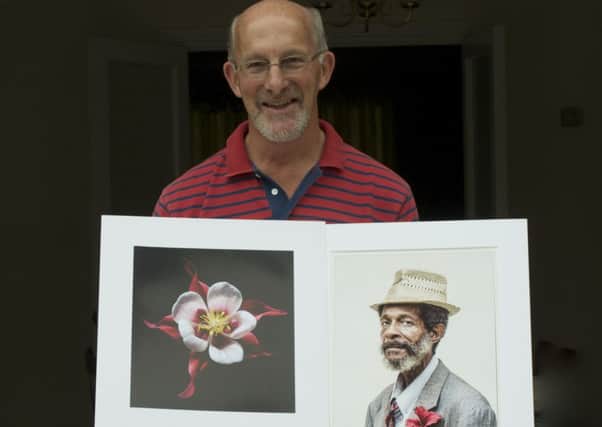 Philip Hoare of Leamington Spa Photographic Society with two of the prints included in the exhibition.