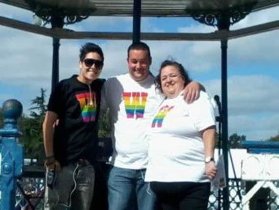 Daniel Browne (centre) with supporters at last year's Warwickshire Pride festival in Leamington.