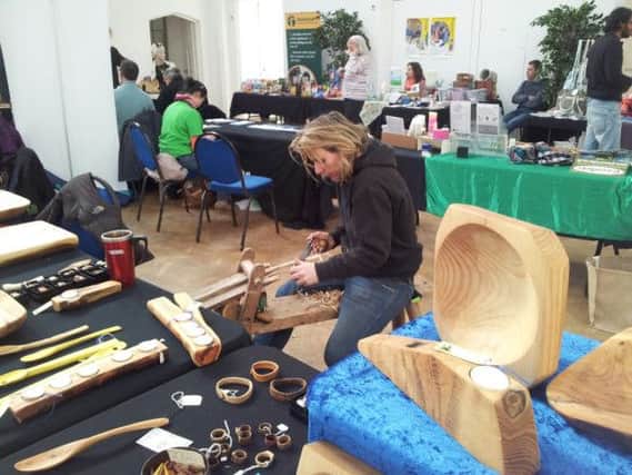 Sue Swatridge from Against the Grain demonstrates woodcraft skills.