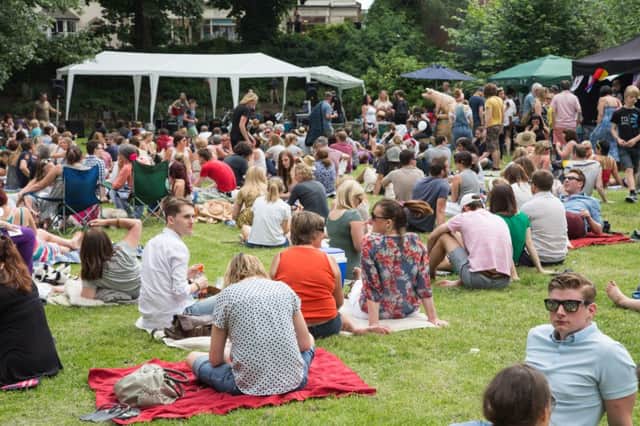 Crowds enjoy sunny weather, live music, art and food at the Doin It In The Dell festival. Picture by Simon Burgess.