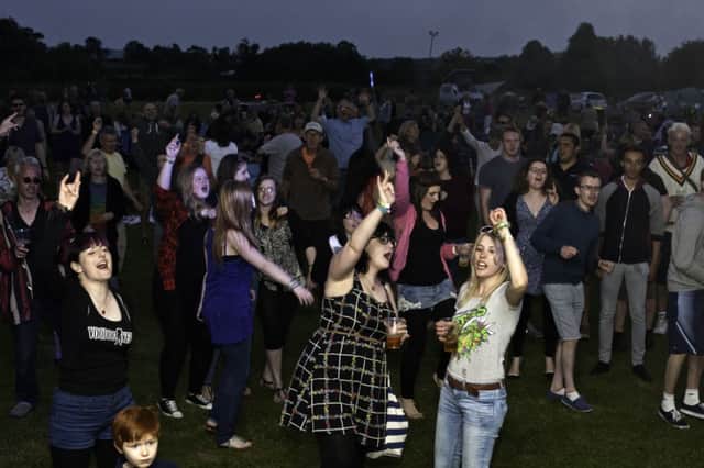 Crowds partying on into the night at Kineton Music Festival.