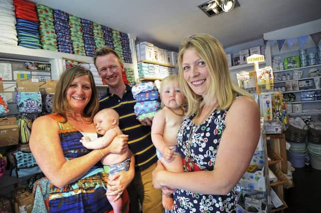 Cotton Nappy Company owner Anna Leeksma (far right) with her daughter Harriet and customers Sarah and Rob Geraghty and their son Freddy at the shop in Leamington.