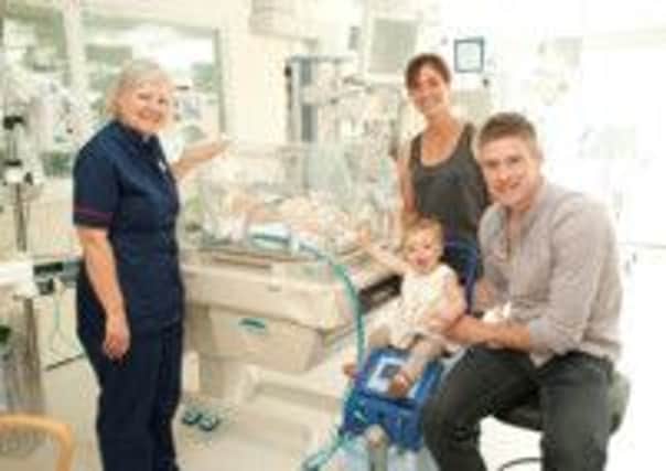 Nancy on a cooling machine. with parents, Joel and Julia Mildinhall and a staff nurse. Picture submitted