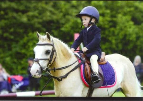 Ila Wingrove on her way to Hickstead glory on board Splodgy. Picture submitted