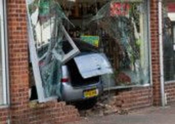 A car crashed through the front of a shop in Woodloes, Warwick, on Saturday. Picture by Gary Dagnall.