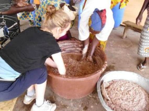Natasha Medley-Whitfield taking part in an activity with women in a rural community in Burkina Faso.