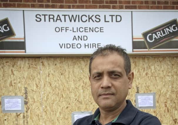 Pictured: Shop owner Shetan Patel who was working in his off licence, when a car crashed through the shop front. NNL-140907-010517009