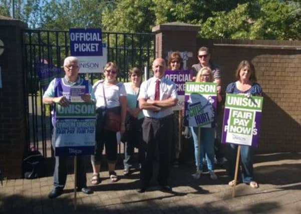 Unison members have formed a picket line outside Warwick District Council's Riverside House HQ in Leamington.
