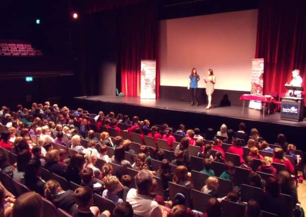 2014 Junior Book Award winner Katherine Rundell, author of Rooftoppers - and the runner-up - Janis Mackay, author of The accidental time traveller on stage at the Spa Centre.