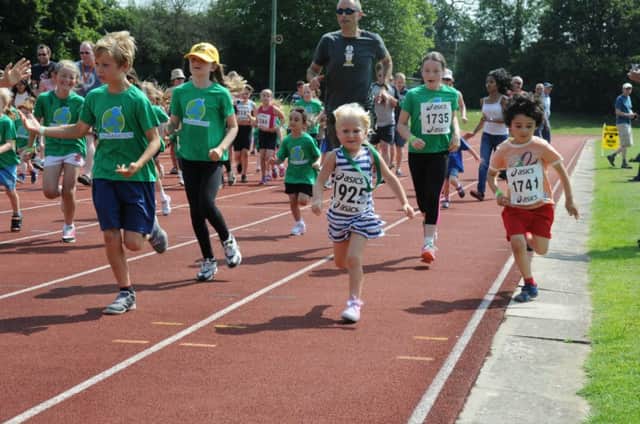 Children taking part in competitive running at the Kids Run Free festival 2014.