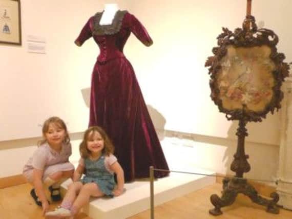 Children at Leamington Art Gallery have a look at the Regency-themed exhibits.