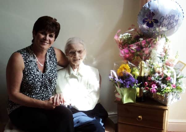 Joyce Hammond on her 102nd birthday with Hilary Lawson, Kineton Manor Nursing Home's lead carer and activities co-ordinater.