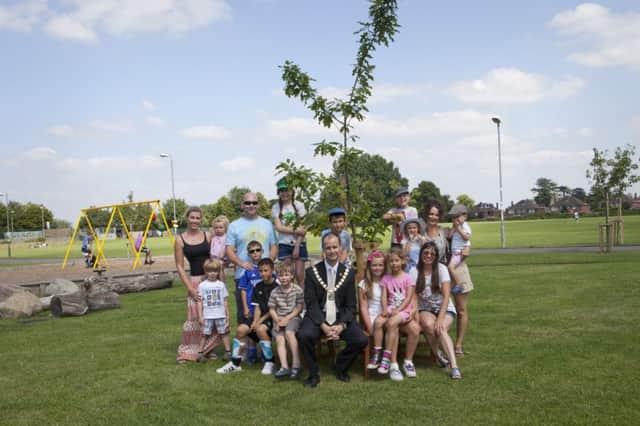 The mayor of Whitnash Cllr Robert Margrave with members of the Friends of Acre Close and the newly planted oak tree.