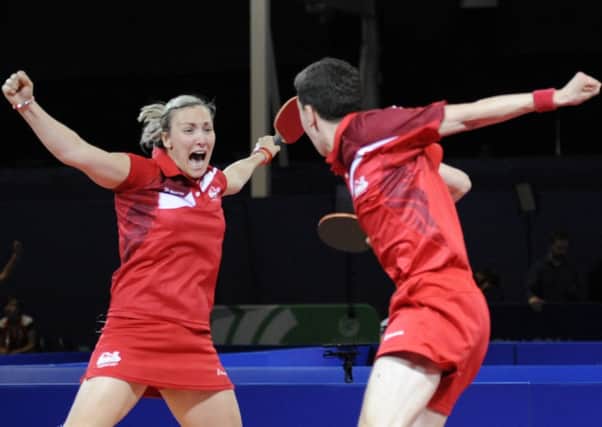 Kelly Sibley celebrates with Danny Reed after claiming a bronze in the mixed doubles at Glasgow 2014. Picture: ITTF