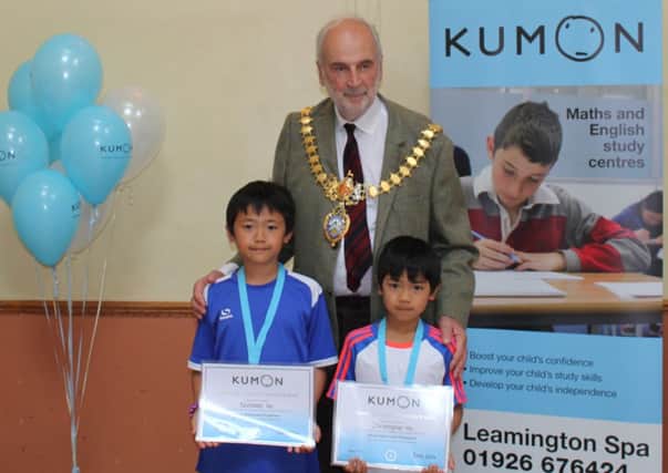Kumon Leamington students Nicholas and Christopher Ho receive their   Advanced Students Honor Roll (ASHR) medals and certificates from Leamington Mayor Clllr John Knight.