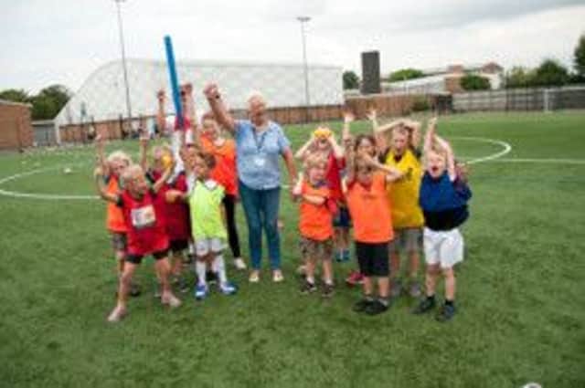 Warwick district councillor Sur Gallagher with children who took part in the Summer Games in Kenilworth.