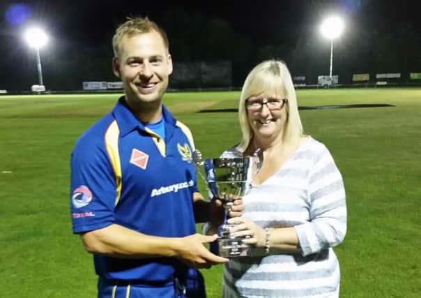 Martin Donald receives the Carrick Travel Floodlit T20 Cup from Tina Nason. Picture submitted