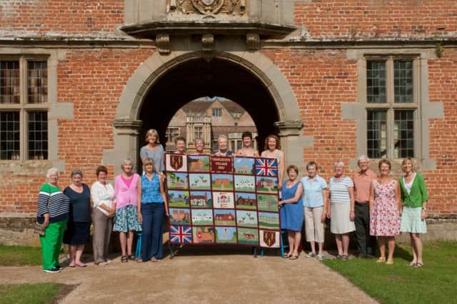 Stitchers with the the Charlecote Wallhanging at Charlecote Park.