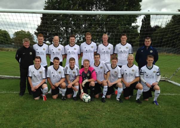 Whitnash Town line up ahead of the 2014/15 season in their new Ace Scaffolding-sponsored kit.