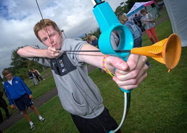 Rhys Bevan tried out archery at the WAYC Fun Day in Leamington.