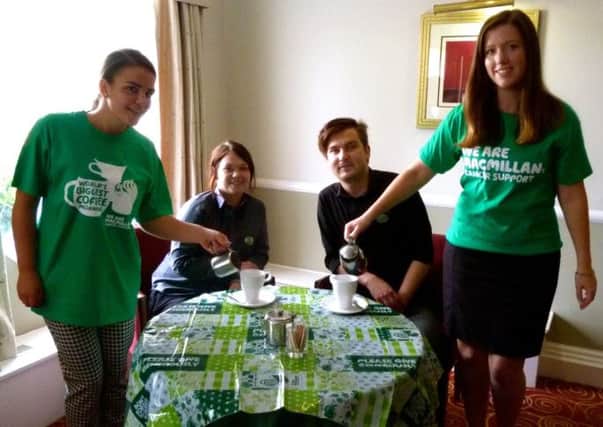 Staff at Holiday Inn in Ryton-on-Dunsmore prepare for their Macmillan coffee morning.