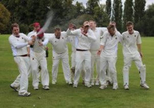 Leek Wootton 1sts celebrate their title.