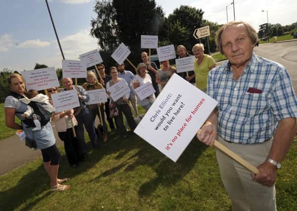 Councillors and local residents gathered outside the sewage works on Stratford Road, recently, to protest at the proposal to site a gypsies site in the surrounding area. NNL-140209-190838009