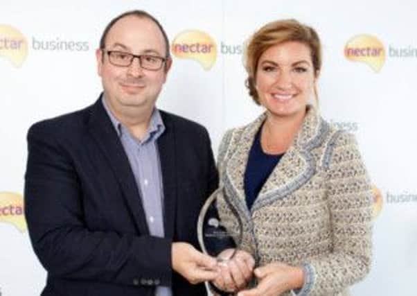 Raffy Duffy of Mask-arade receives the Homegrown Business of the Year prize from Karen Brady CBE at the  Nectar Business Small Business Awards 2014. Picture by David Parry. jg9xDfvM4_6oOYx8KvEj