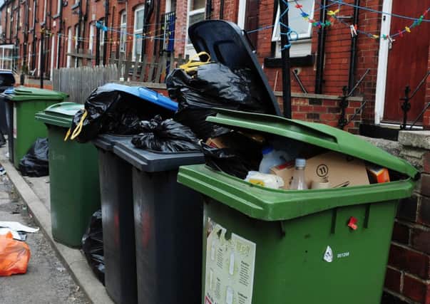 Overflowing bins: editorial image