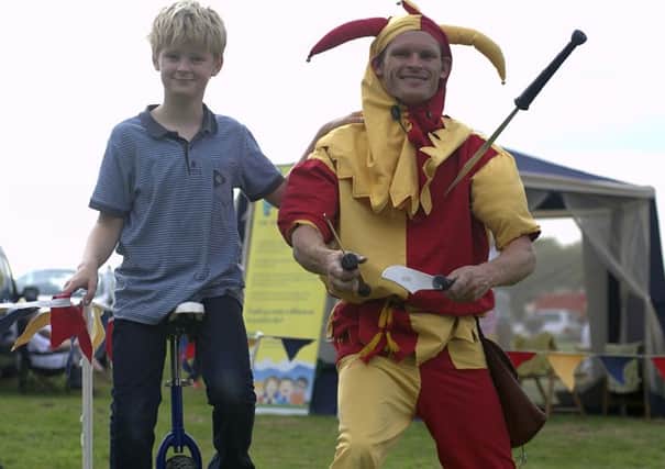 Abbey Fields hosted 'Party in the Park', on Sunday, with a variety of live music, entertainment and stalls.

Pictured: Oscar Gupwell & The Fool Monty Jester NNL-140914-212305009
