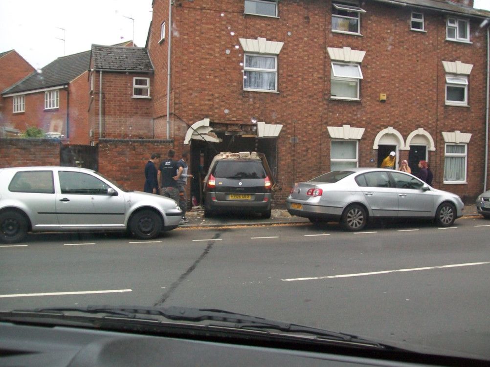 Car crashes through front of Warwick house