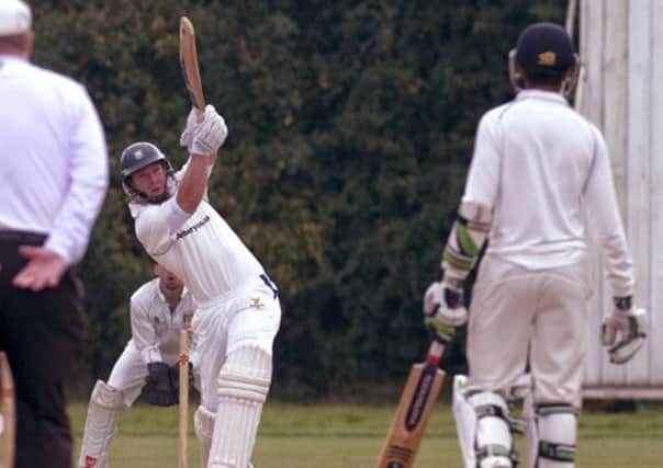 Nick Seager launches the ball high on his way to a useful 20 for Kenilworth Wardens. Picture: Mike Baker