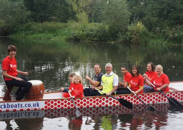 Kate Lee, chief executive of Myton Hospice, prepares to beat the drums as her team takes to the Avon in their first dragon boat race.