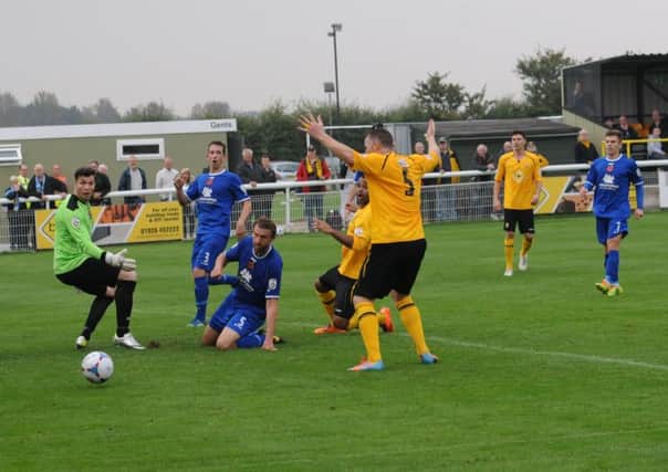Below: Stuart Pierpoint is mid-celebration, only to see Stefan Moore screw his shot wide. Picture: Morris Troughton.