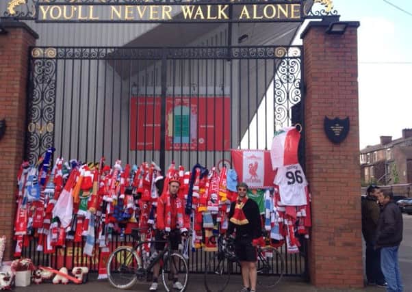 James Pratt and Steven Mayers visit Anfield during their cycle from Land's End to John O'Groats