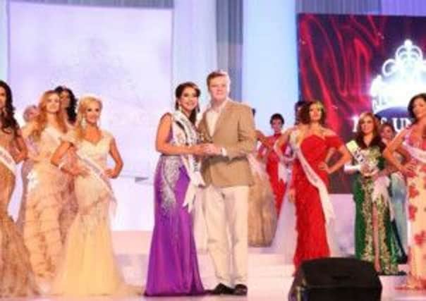 Nicky Sanghera receives the Mother of the Universe award at the Mrs Universer 2014 finals in Malaysia.